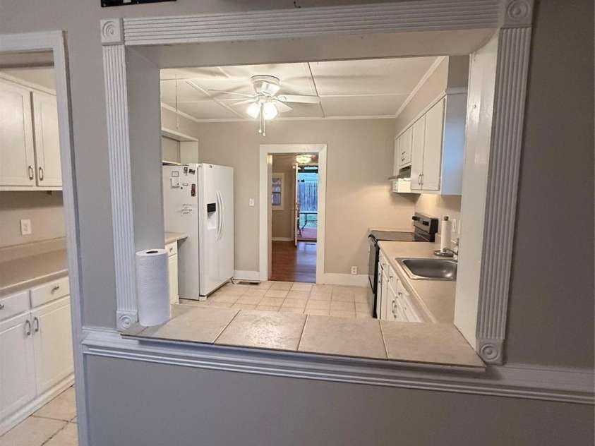 4220 Harvard Avenue, Greensboro, NC 27407.  MLS# CAR4405313, YatesRealty ID 38886. Pass-through into kitchen.View into kitchen