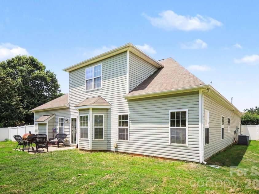 6900 Daisy Bee Court, Charlotte, NC 28126.  MLS# CAR4405840, YatesRealty ID 38899. Back Exterior