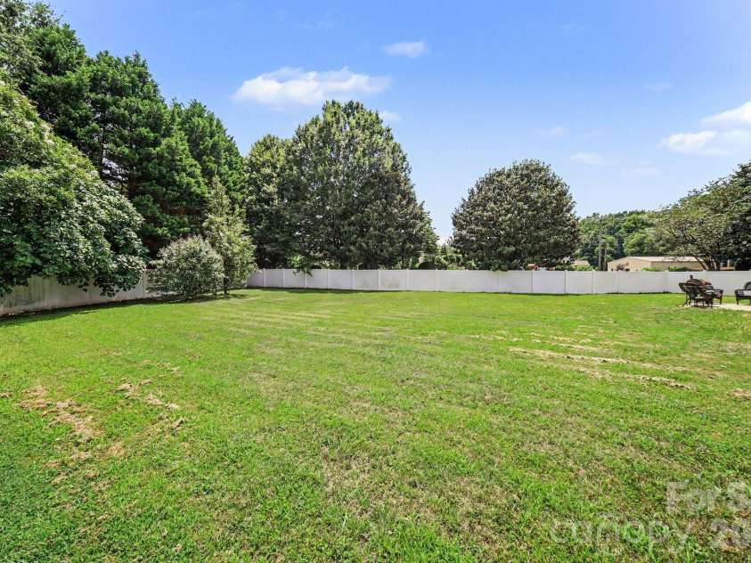 6900 Daisy Bee Court, Charlotte, NC 28126.  MLS# CAR4405840, YatesRealty ID 38899. Spacious backyard