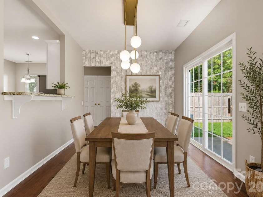 5219 Bentgrass Run Drive, Charlotte, NC 28269.  MLS# CAR4399258, YatesRealty ID 38901. Dining Room decorated by ChatGPT