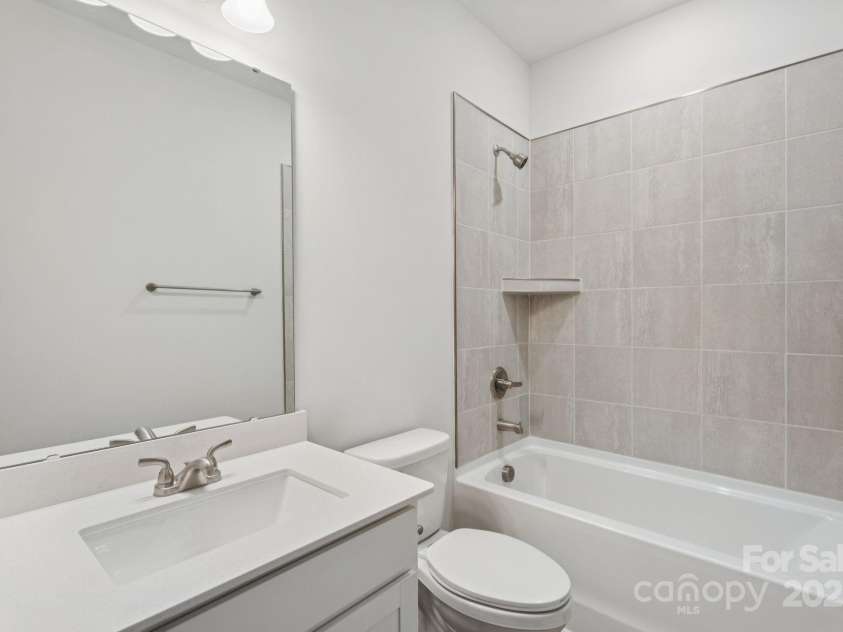 4742 Lakeview Road, Charlotte, NC 28216.  MLS# CAR4261326, YatesRealty ID 3891. Hall Full Bathroom with Tiled wall surround