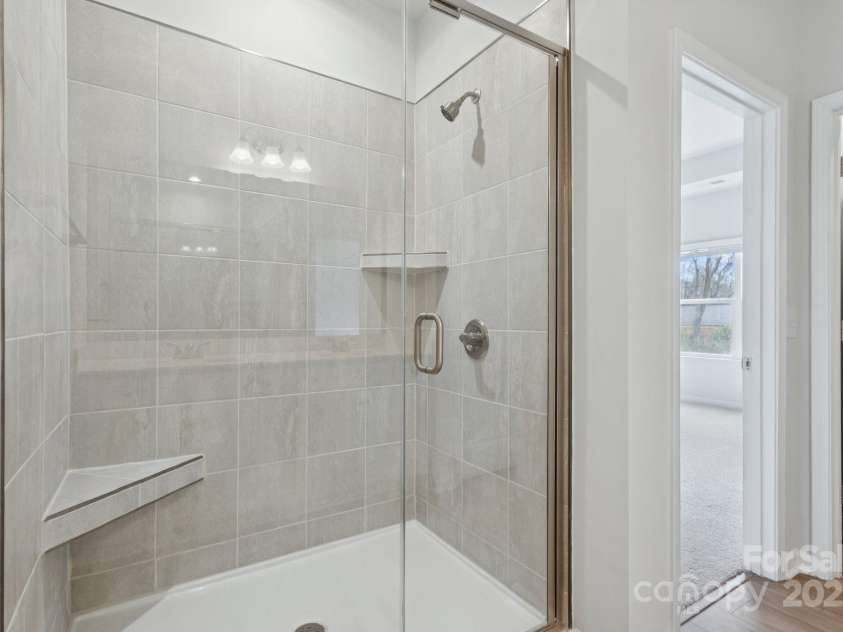 4742 Lakeview Road, Charlotte, NC 28216.  MLS# CAR4261326, YatesRealty ID 3891. Primary Bathroom Tiled Walk-in Shower