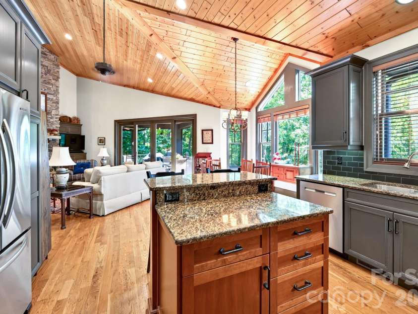 33 Hawks Branch Circle, Fairview, NC 28730.  MLS# CAR4403173, YatesRealty ID 38919. Kitchen island with granite countertops and generous workspace