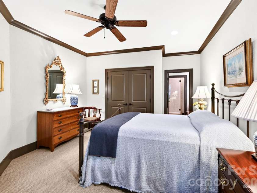 33 Hawks Branch Circle, Fairview, NC 28730.  MLS# CAR4403173, YatesRealty ID 38919. Lower-level bedroom with ensuite bath