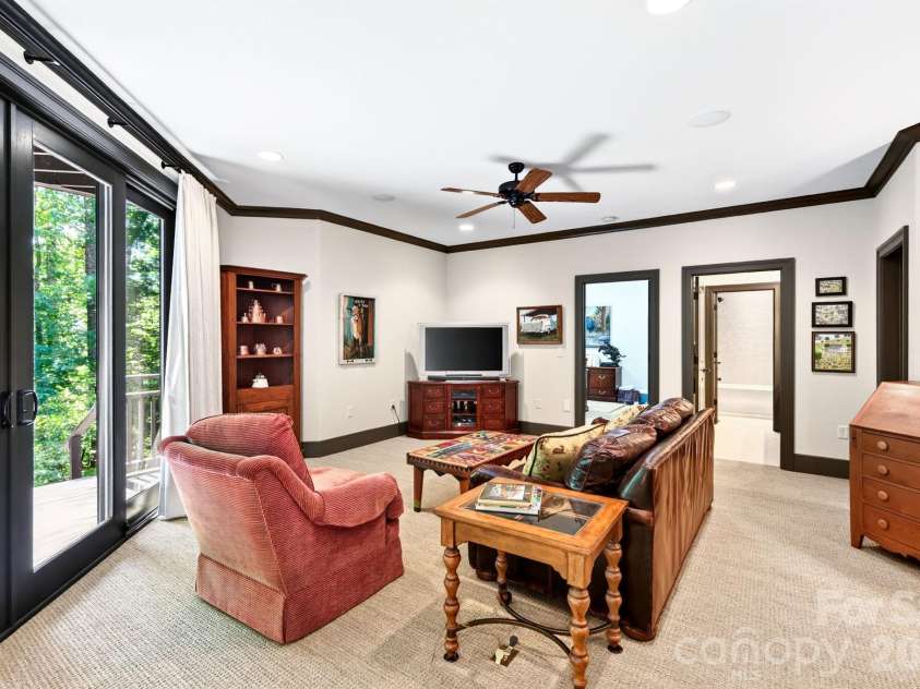 33 Hawks Branch Circle, Fairview, NC 28730.  MLS# CAR4403173, YatesRealty ID 38919. Lower-level family room with access to the second deck