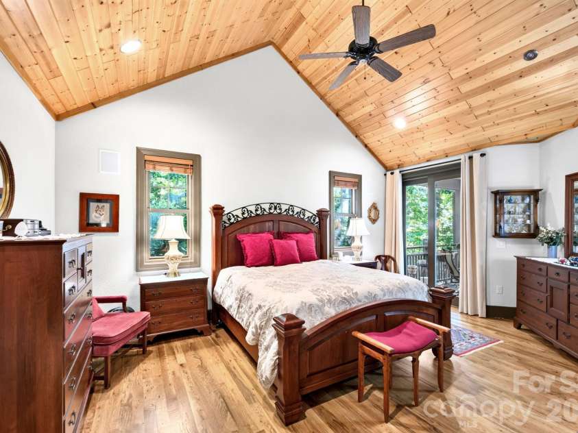 33 Hawks Branch Circle, Fairview, NC 28730.  MLS# CAR4403173, YatesRealty ID 38919. Spacious primary suite with deck access and wooded views