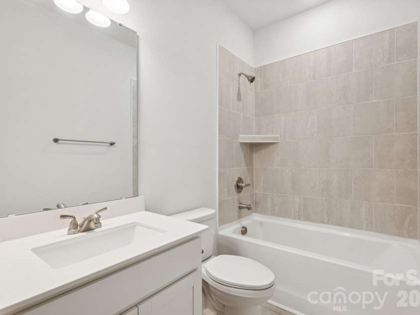 5106 Orchardview Way, Charlotte, NC 28216.  MLS# CAR4335326, YatesRealty ID 3893. 2nd floor hall bath with tile walls