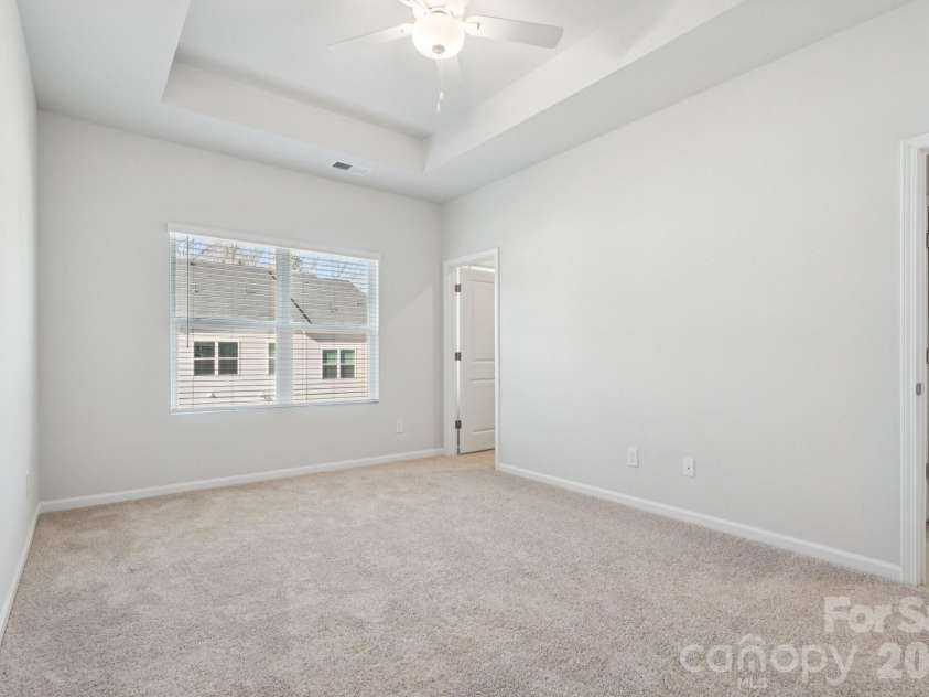5106 Orchardview Way, Charlotte, NC 28216.  MLS# CAR4335326, YatesRealty ID 3893. Primary Bedroom with 10' tray ceiling
