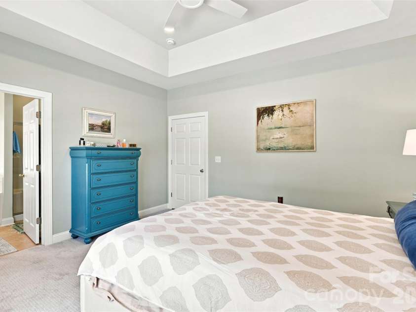 1248 Curry Way, Matthews, NC 28104.  MLS# CAR4406039, YatesRealty ID 38938. Primary bedroom- tray ceiling, ensuite bath, WIC