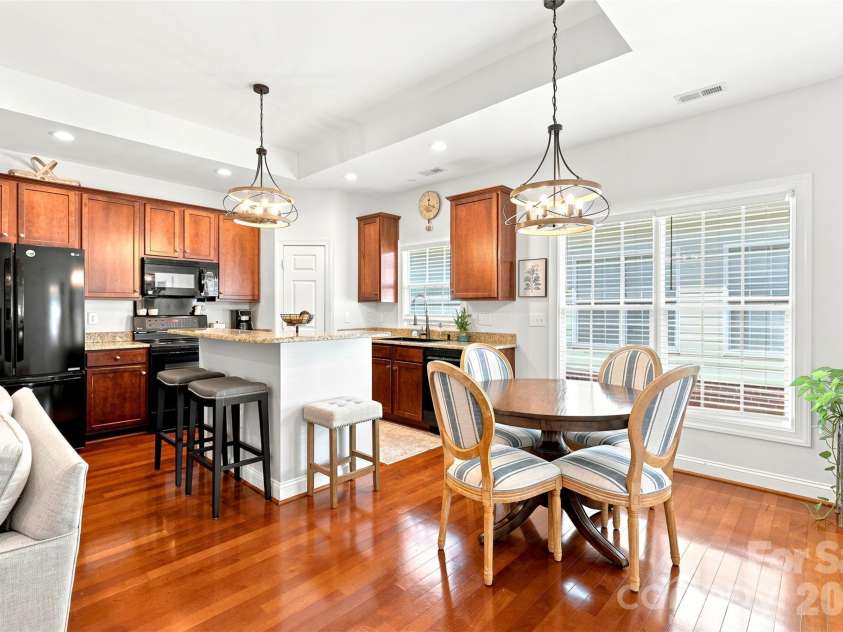 1248 Curry Way, Matthews, NC 28104.  MLS# CAR4406039, YatesRealty ID 38938. View of dining area + kitchen