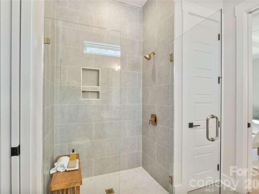 2085 Bonds Lane, Fort Mill, SC 29715.  MLS# CAR4257392, YatesRealty ID 3895. Walk-in shower with designer tile