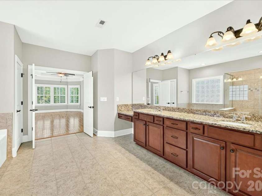 13116 May River Lane, Charlotte, NC 28278.  MLS# CAR4403294, YatesRealty ID 38951. Double sinks and a make up desk