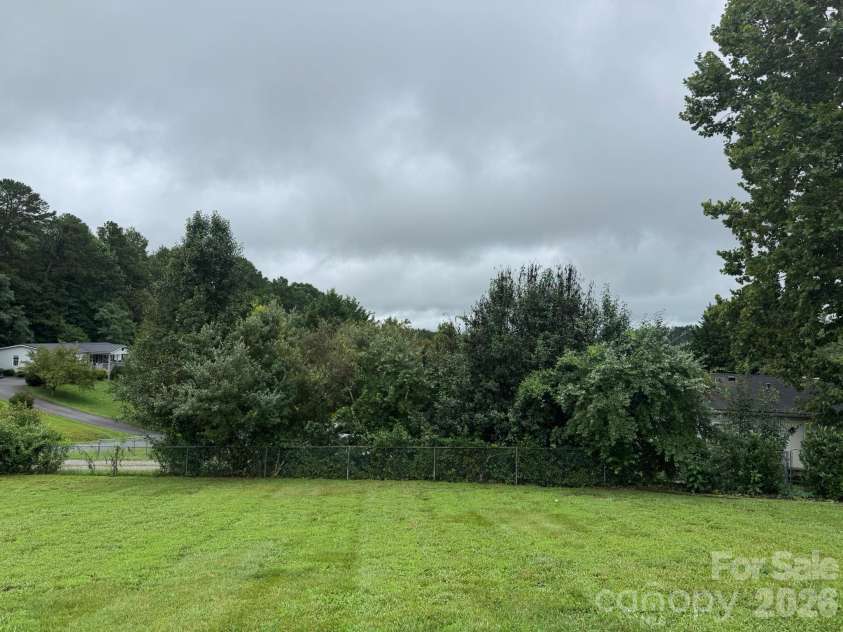 213 Sandy Creek Court, Hendersonville, NC 28792.  MLS# CAR4406111, YatesRealty ID 38956. Private backyard