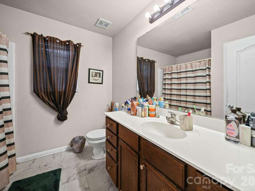 414 East Village Drive, Monroe, NC 28112.  MLS# CAR4406542, YatesRealty ID 38957. Primary bathroom