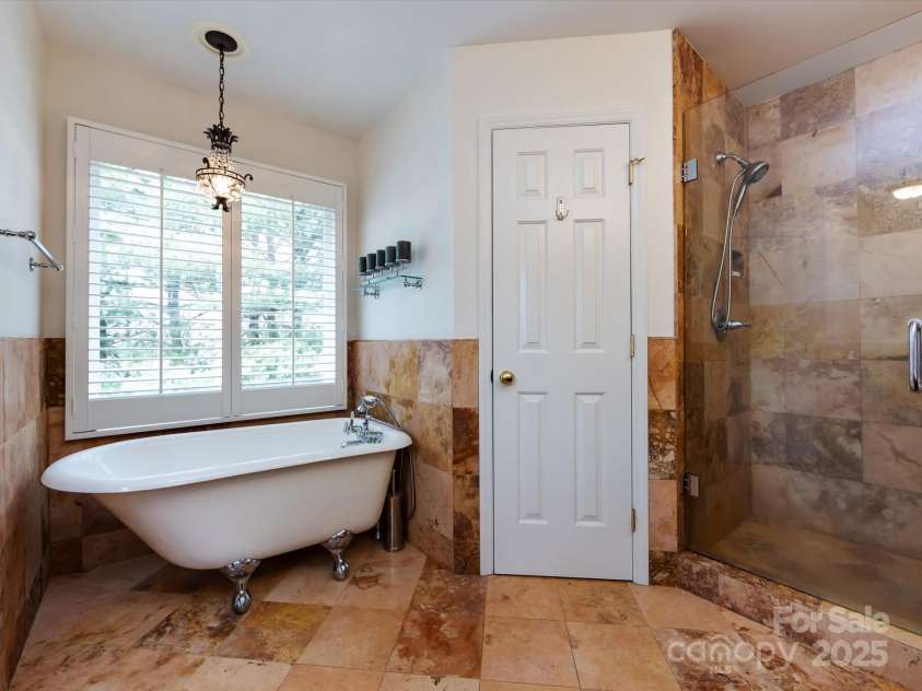 9901 Lariat Court, Huntersville, NC 28078.  MLS# CAR4237855, YatesRealty ID 3897. Primary bath with claw foot tub