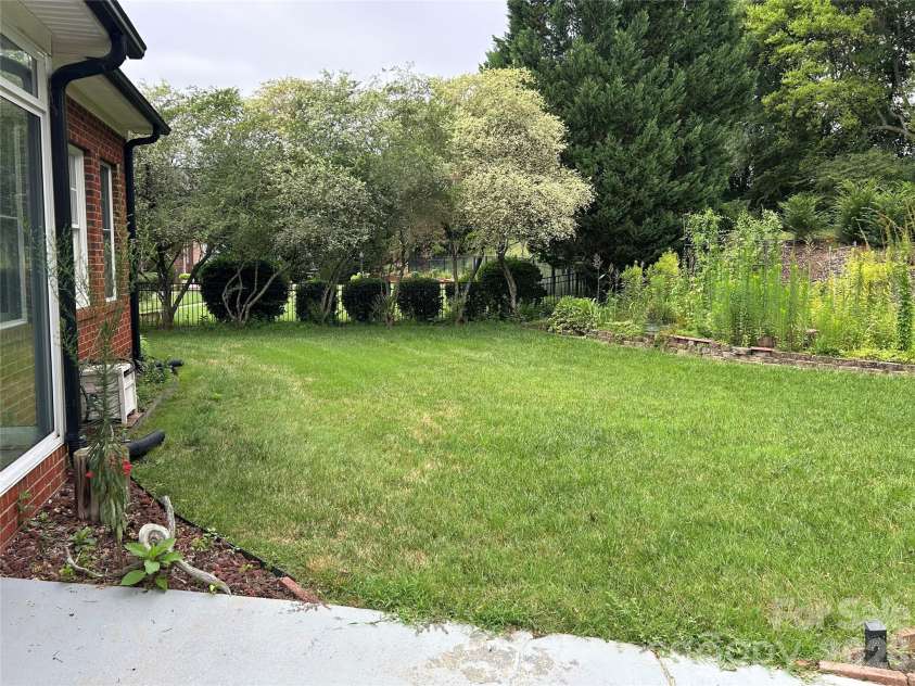 3968 Troon Drive, Concord, NC 28027.  MLS# CAR4405391, YatesRealty ID 38970. Back Yard -