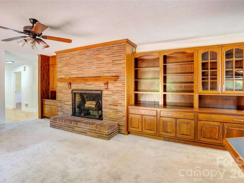 688 Grandview Drive, Concord, NC 28025.  MLS# CAR4433877, YatesRealty ID 38977. Brick fireplace and builtins - den area