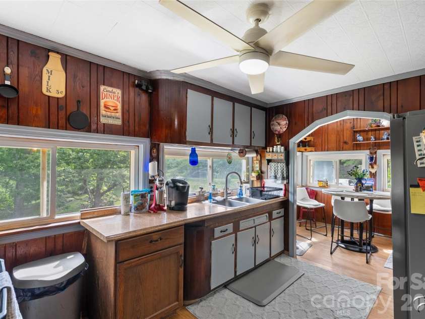 3151 Bearwallow Road, Hendersonville, NC 28792.  MLS# CAR4403717, YatesRealty ID 38983. Open air kitchen w/natural lighting