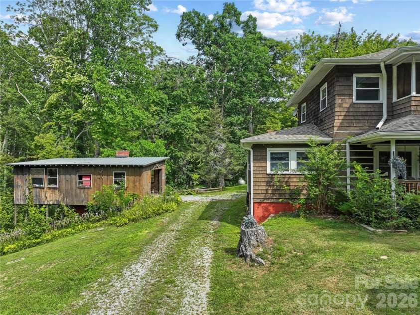 3151 Bearwallow Road, Hendersonville, NC 28792.  MLS# CAR4403717, YatesRealty ID 38983. Side view with detached garage