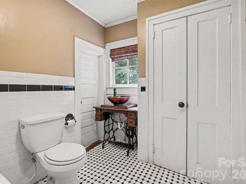 75 Cabarrus Avenue, Concord, NC 28025.  MLS# CAR4406575, YatesRealty ID 38993. Bathroom Downstairs