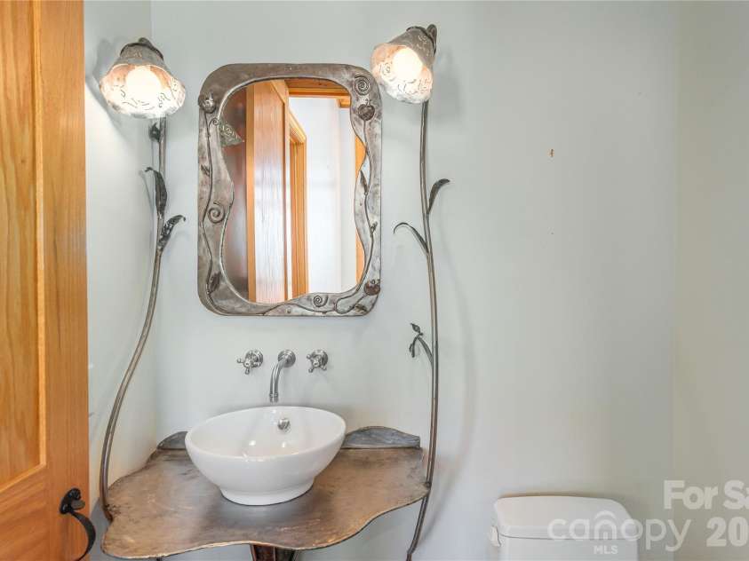 98 Flat Creek Road, Fairview, NC 28730.  MLS# CAR4395536, YatesRealty ID 38996. Artistic creations throughout