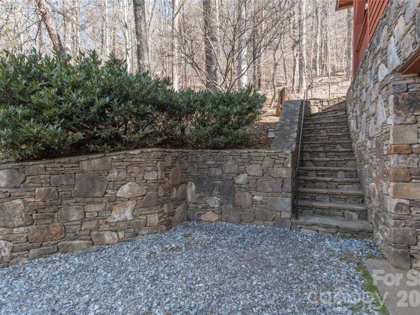 98 Flat Creek Road, Fairview, NC 28730.  MLS# CAR4395536, YatesRealty ID 38996. Extensive stone masonry