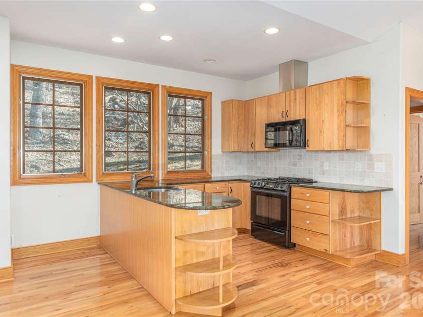 98 Flat Creek Road, Fairview, NC 28730.  MLS# CAR4395536, YatesRealty ID 38996. Guest house kitchen
