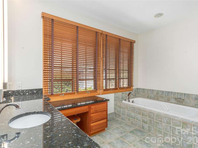 98 Flat Creek Road, Fairview, NC 28730.  MLS# CAR4395536, YatesRealty ID 38996. Primary bath with separate tub