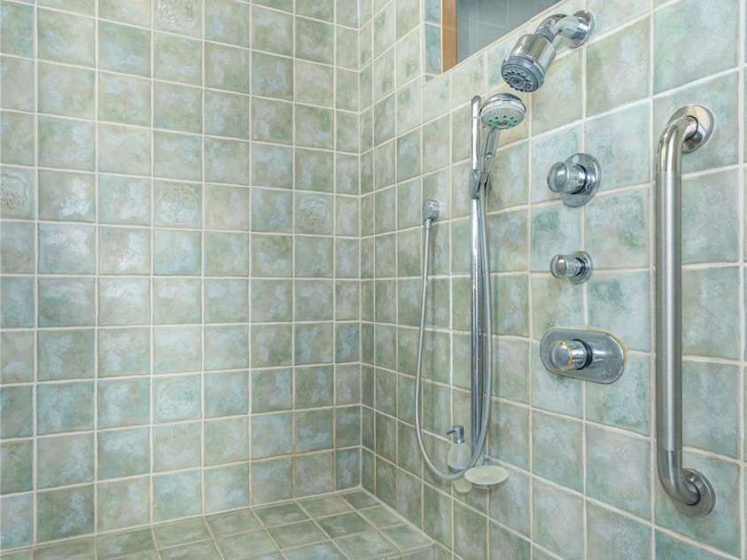 98 Flat Creek Road, Fairview, NC 28730.  MLS# CAR4395536, YatesRealty ID 38996. Primary bath with steam shower