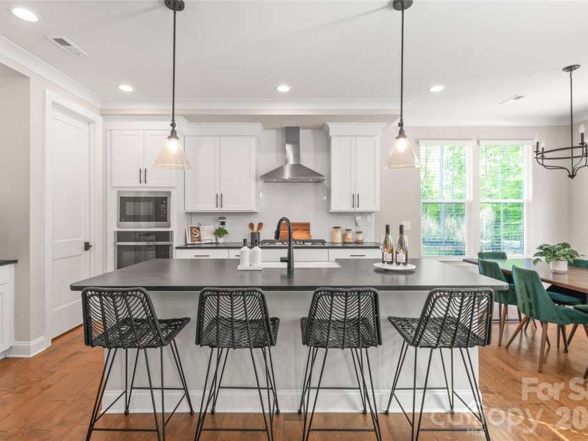 3213 Timber Run Lane, Maiden, NC 28650.  MLS# CAR4371806, YatesRealty ID 39002. Complete with a spacious walk-in pantry for effortless organization, it’s a space where high-end style meets total functionality.