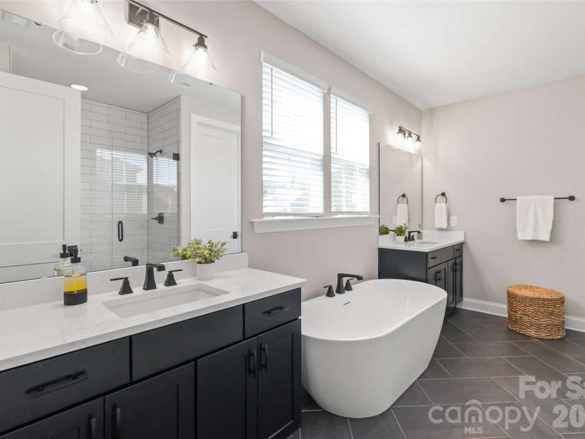 3213 Timber Run Lane, Maiden, NC 28650.  MLS# CAR4371806, YatesRealty ID 39002. This en-suite feature two separate vanities with soft close drawers/cabinets, giving everyone their own dedicated space to prep and pamper.