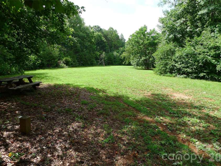 241 Grannaman Drive, Mocksville, NC 27028.  MLS# CAR4406242, YatesRealty ID 39017. Cleared grassy area