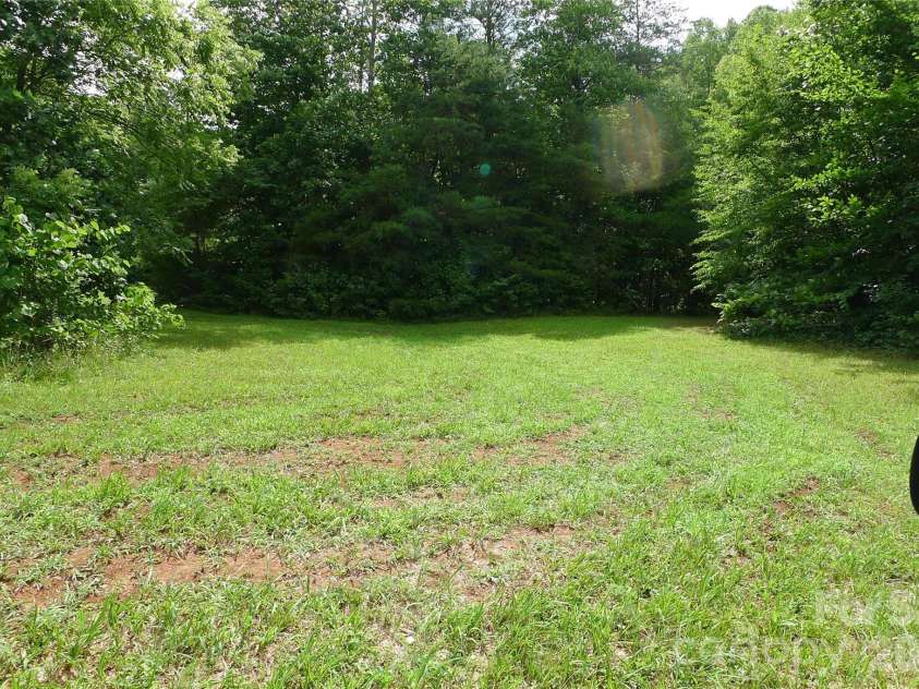 241 Grannaman Drive, Mocksville, NC 27028.  MLS# CAR4406242, YatesRealty ID 39017. Cleared grassy area