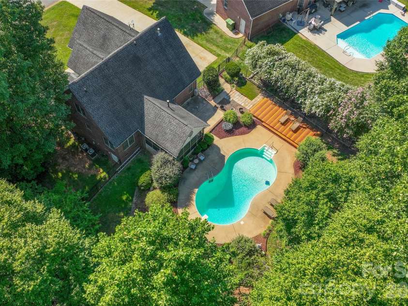 1006 Strawberry Lane, Gastonia, NC 28054.  MLS# CAR4372022, YatesRealty ID 39018. Amazing Pool with Diving Board and Sundeck