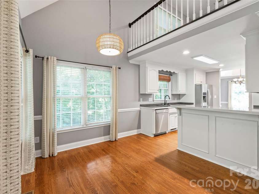 1006 Strawberry Lane, Gastonia, NC 28054.  MLS# CAR4372022, YatesRealty ID 39018. Breakfast Room looking into kitchen with view from upstairs