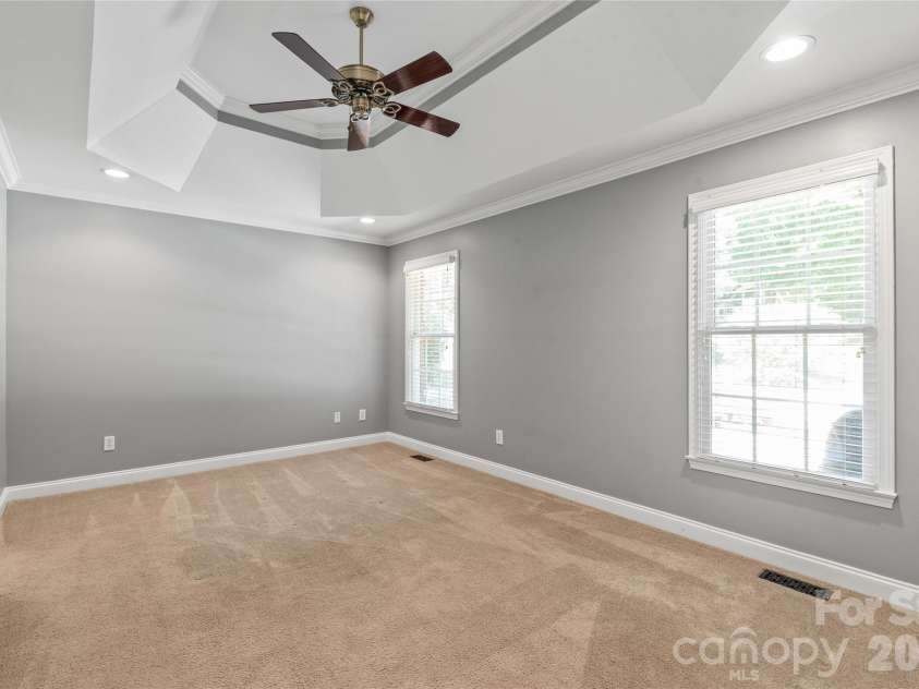 1006 Strawberry Lane, Gastonia, NC 28054.  MLS# CAR4372022, YatesRealty ID 39018. Primary Bedroom on the main level with Tray Ceiling