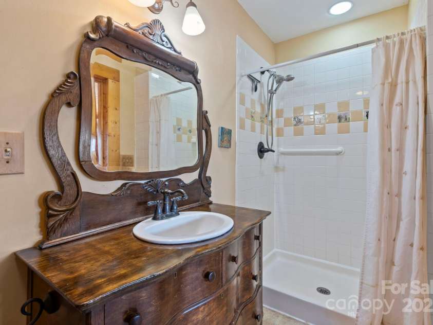 104 Enthoffer Street, Black Mountain, NC 28711.  MLS# CAR4328758, YatesRealty ID 3902. Primary bedroom bath