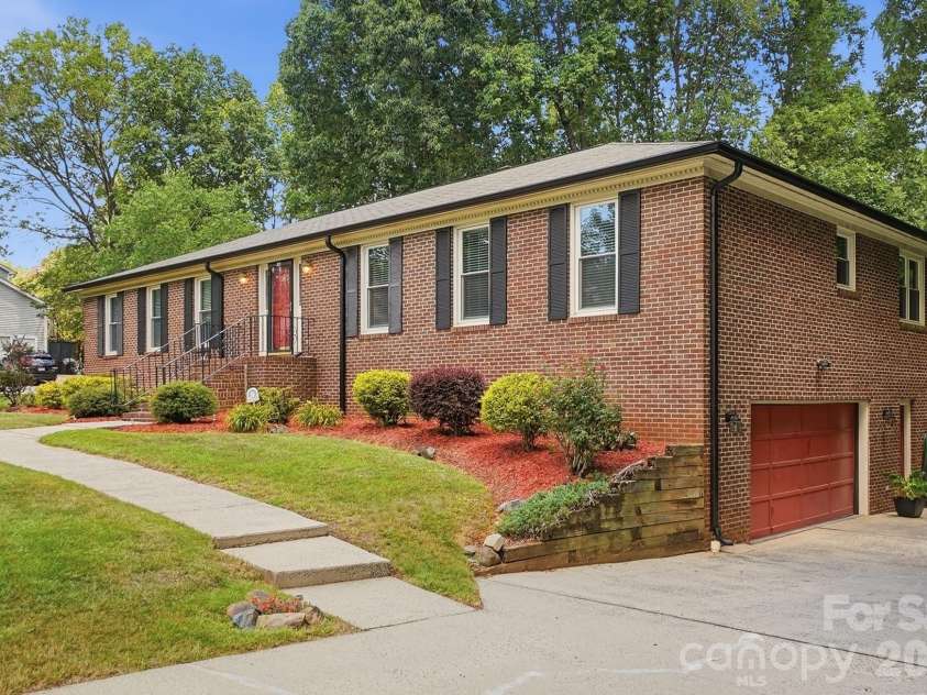 701 Blue Rock Drive, Charlotte, NC 28213.  MLS# CAR4395254, YatesRealty ID 39020. Side load 2 car garage