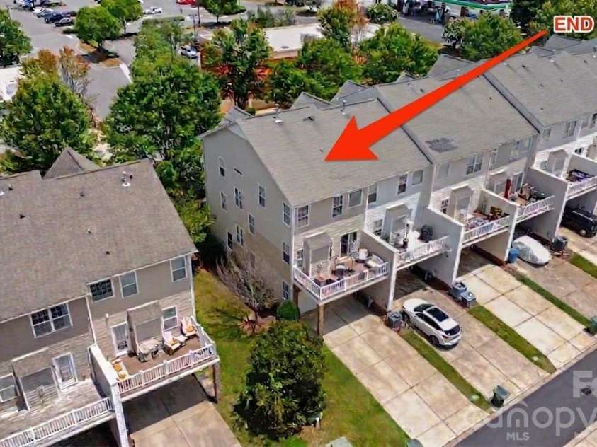7051 Brighton Park Drive, Charlotte, NC 28227.  MLS# CAR4399270, YatesRealty ID 39034. Its an end unit with a deck and a 2 car garage