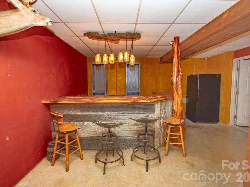 588 Abbeydale Road, Harmony, NC 28634.  MLS# CAR4403987, YatesRealty ID 39036. Entertaining area in basement!
