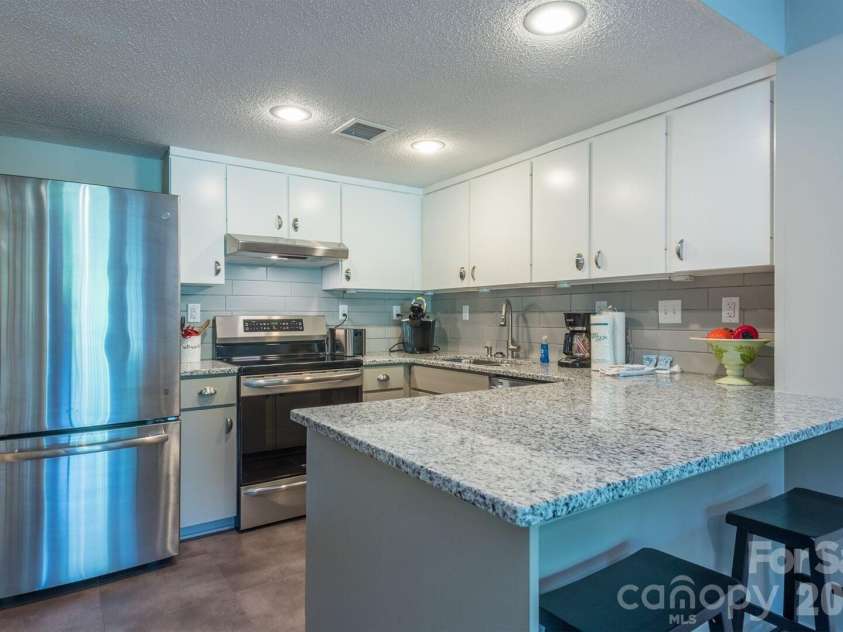 156 Lake Drive, Lake Lure, NC 28746.  MLS# CAR4406437, YatesRealty ID 39040. 