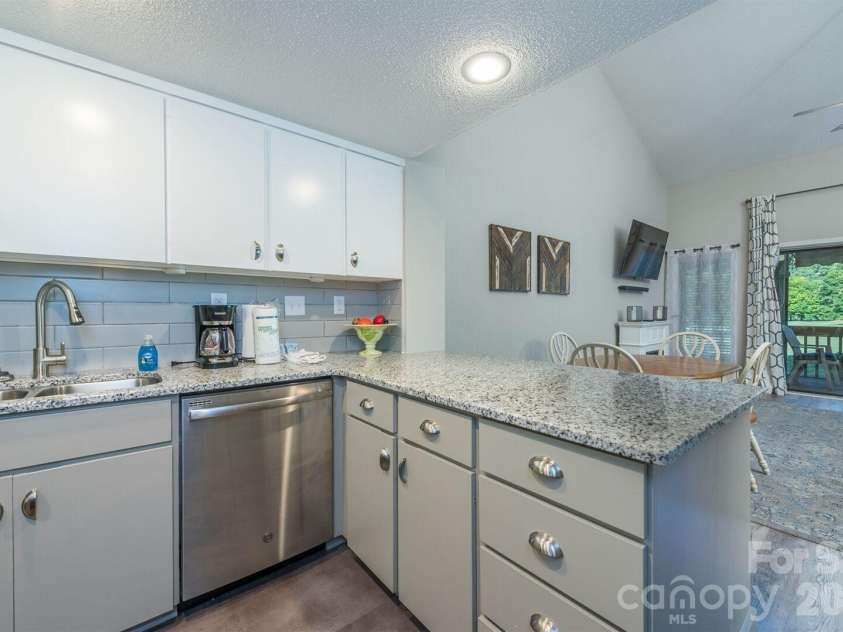 156 Lake Drive, Lake Lure, NC 28746.  MLS# CAR4406437, YatesRealty ID 39040. 