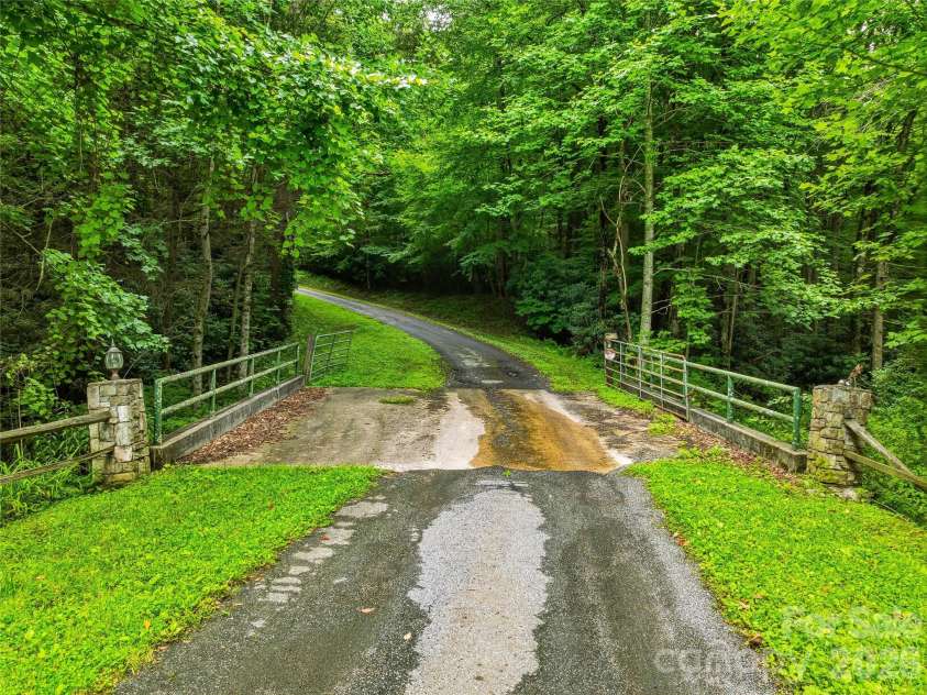 961 Wilson Branch Road, Mars Hill, NC 28754.  MLS# CAR4406664, YatesRealty ID 39042. Bridge over creek