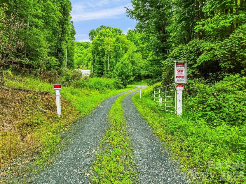 961 Wilson Branch Road, Mars Hill, NC 28754.  MLS# CAR4406664, YatesRealty ID 39042. Gate at Western Boundary