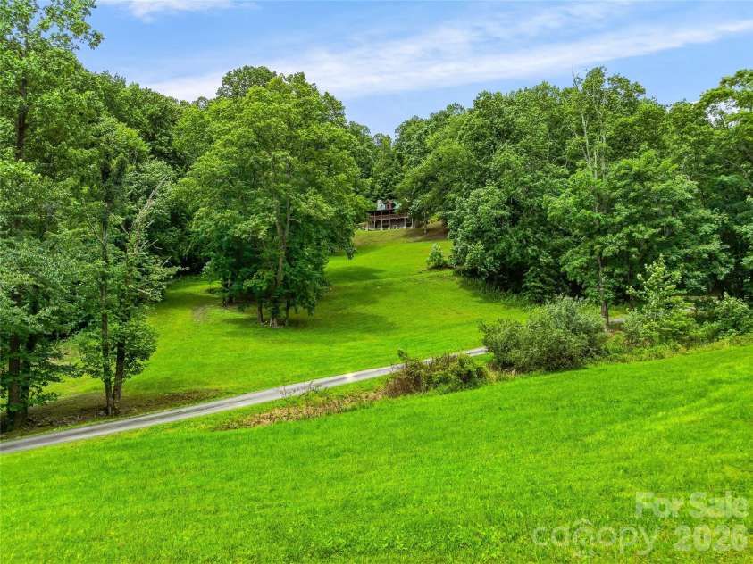 961 Wilson Branch Road, Mars Hill, NC 28754.  MLS# CAR4406664, YatesRealty ID 39042. View looking up towards main cabin