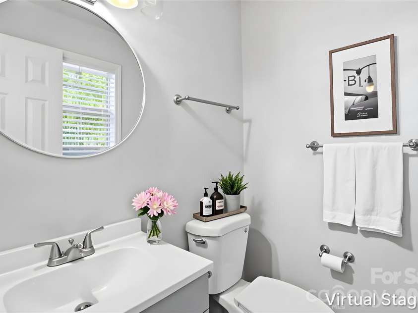2121 Longleaf Drive, Charlotte, NC 28210.  MLS# CAR4400199, YatesRealty ID 39044. Half bath en suite to primary bedroom keeps life super simple, private & convenient (virtually staged & enhanced).
