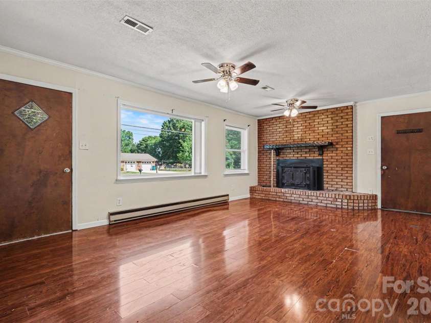 2403 Chevaron Drive, Concord, NC 28025.  MLS# CAR4392827, YatesRealty ID 39047. Living Room with fire place