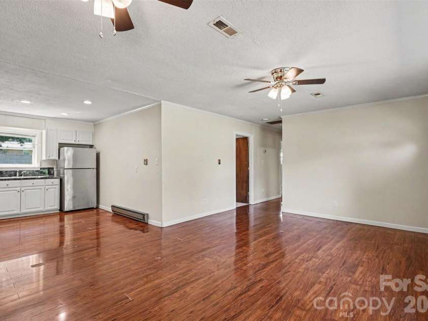 2403 Chevaron Drive, Concord, NC 28025.  MLS# CAR4392827, YatesRealty ID 39047. Open Floor Plan - Kitchen and Living Room
