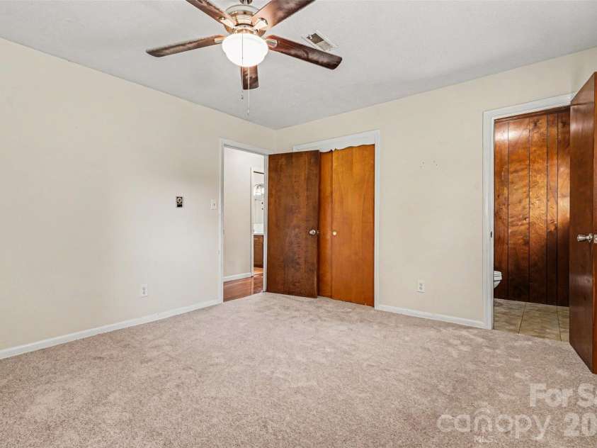 2403 Chevaron Drive, Concord, NC 28025.  MLS# CAR4392827, YatesRealty ID 39047. Primary bedroom with half bath