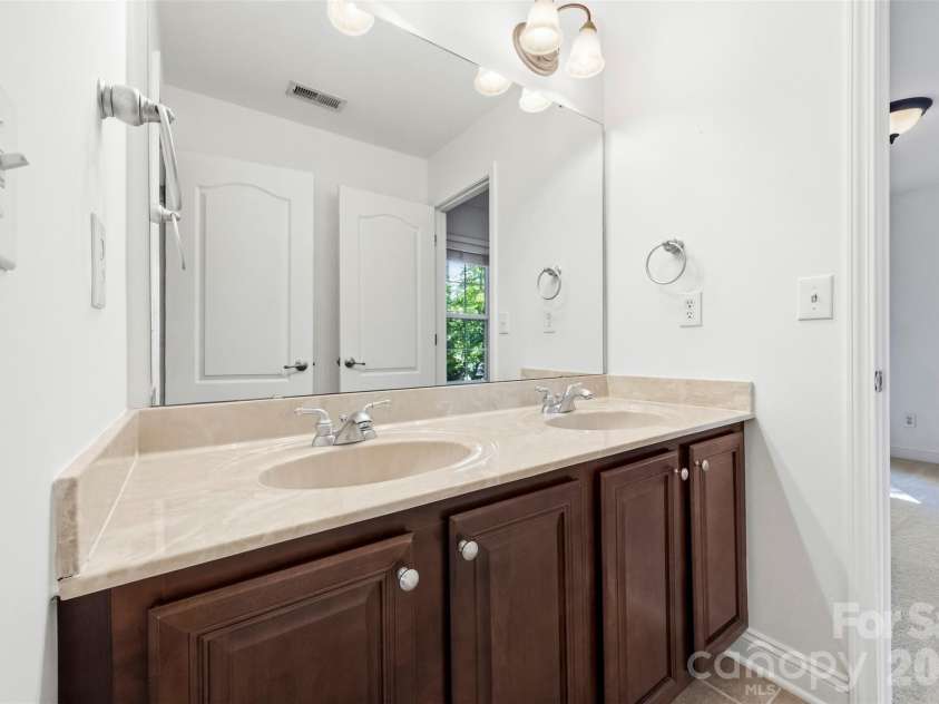 1703 Caddy Court, Matthews, NC 28104.  MLS# CAR4392423, YatesRealty ID 39056. Jack and Jill Bathroom